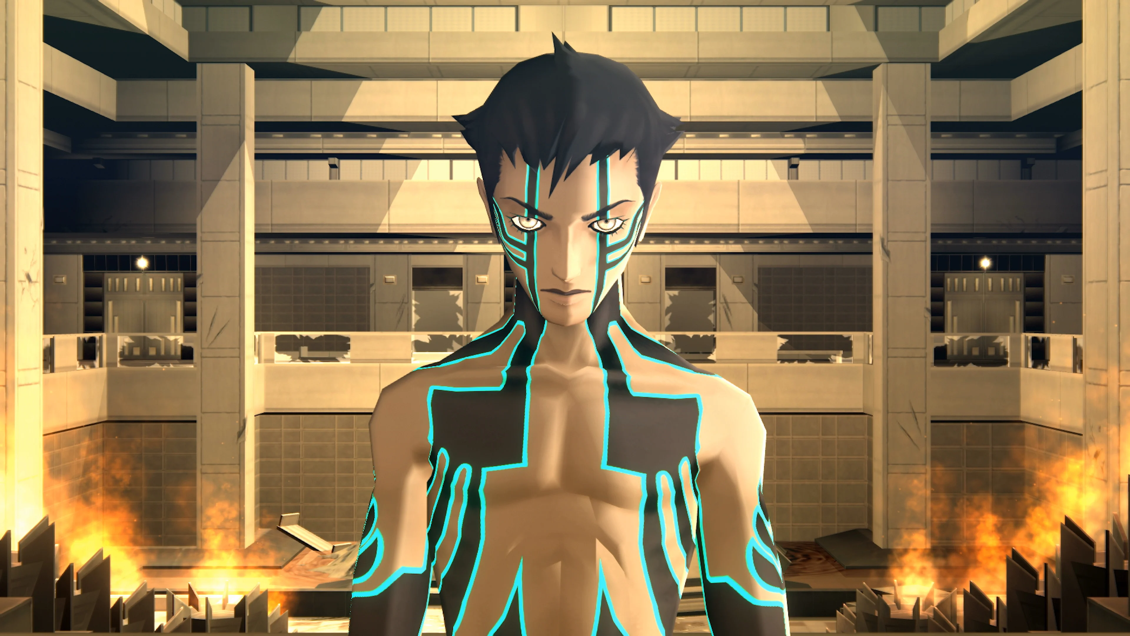 A commonly used image of the main character of Shin Megami Tensei 3: Nocturn, shirtless and covered in glowing blue and black linear tattoos, staring out at the camera from what appears to be a hospital hallway. The edges of the screen are aflame, and glass hand railings behind the M C have been shattered. The Protag has a blank expression despite the ruinous surroundings.